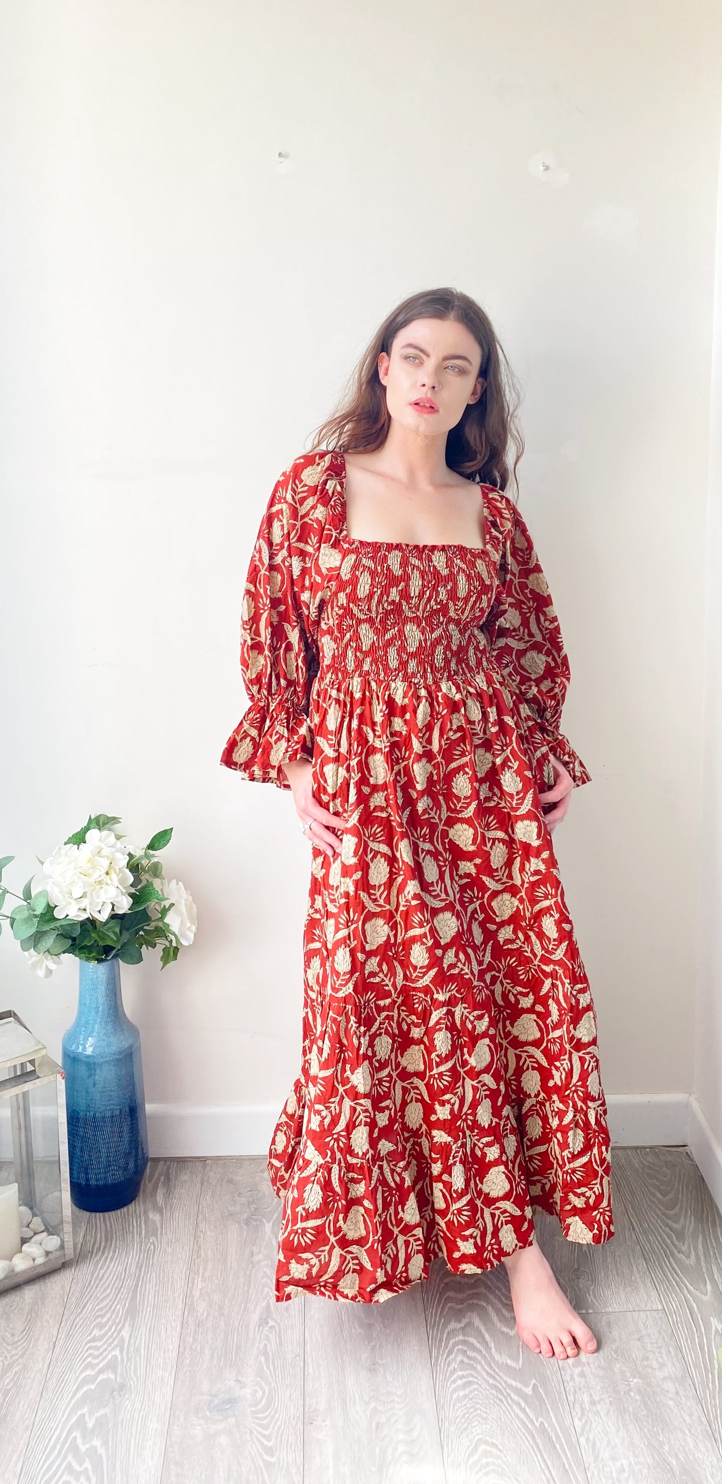 Lila brick-red block-printed cotton bardot balloon-sleeved maxi dress