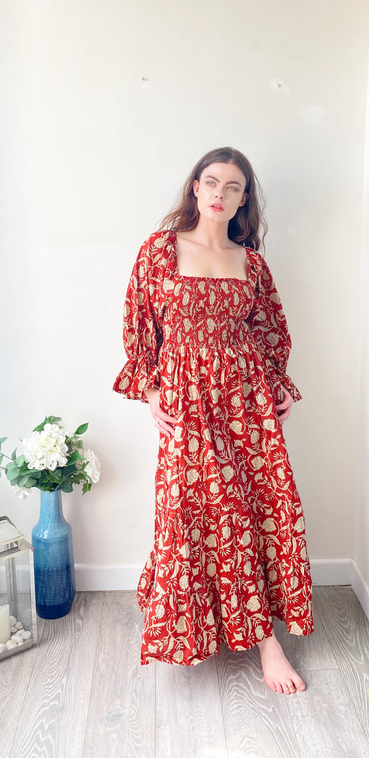 Lila brick-red block-printed cotton bardot balloon-sleeved maxi dress