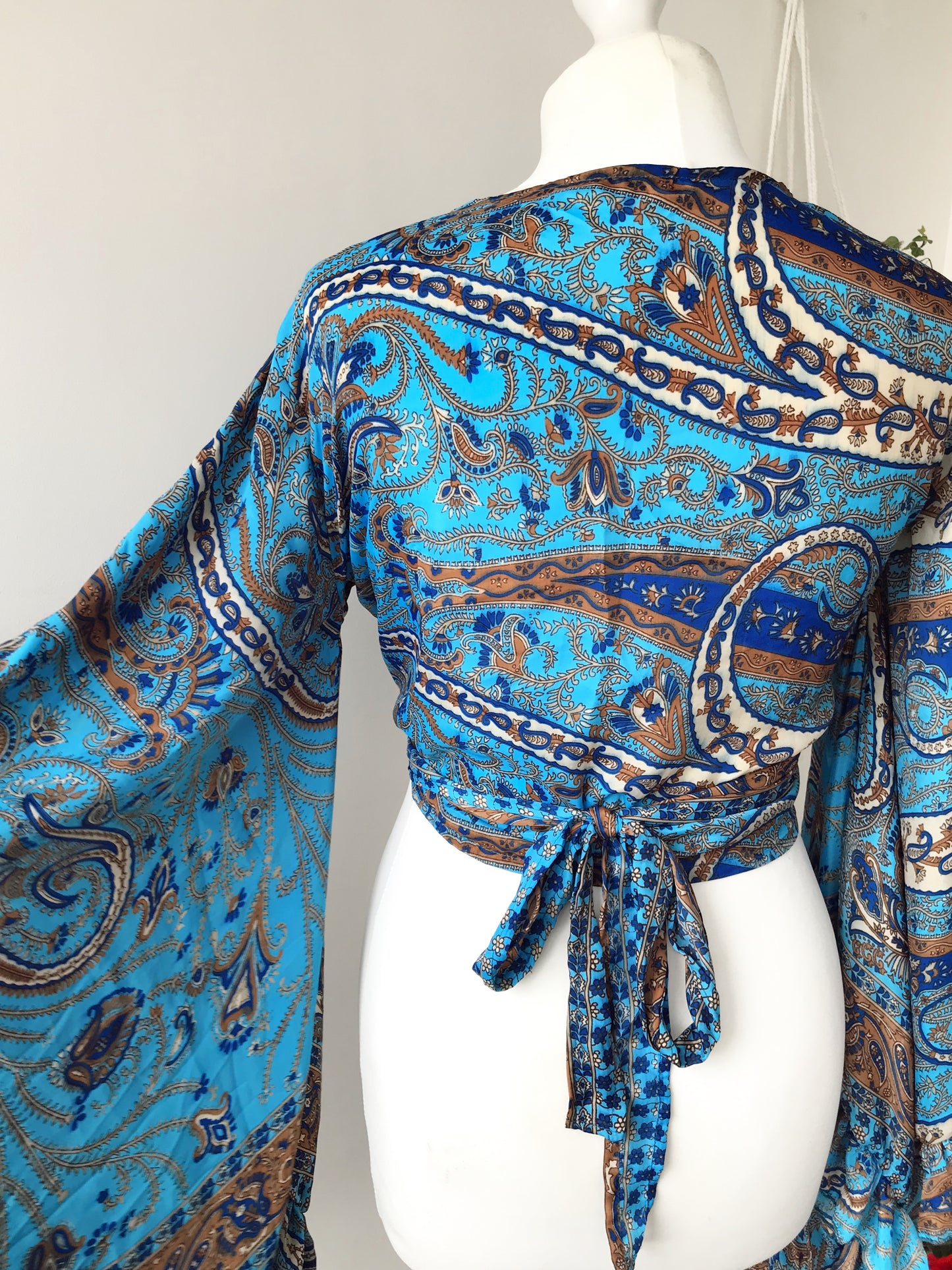 Stevie paisley-print sea-blue silk wrap tie frill-sleeve topblouse